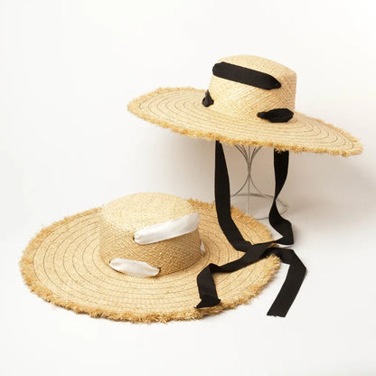 Naturlige Raffia Women Wide Brim Straw Hats Solshade Høy kvalitet Fedora Straw Hats Outdoor Travel Sand Bowknot Straw Hats