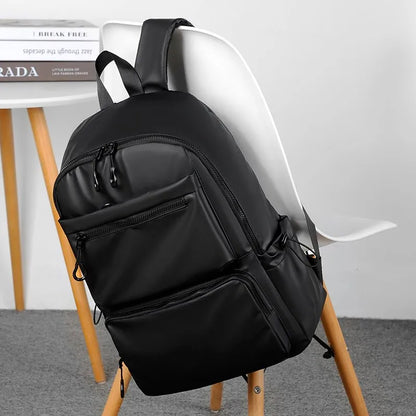 Uma mochila masculina de 14 polegadas de grande capacidade Viagem de lazer sólido colorido pu de mochila mochila de moda Moda e mulher bolsa escolar de estudantes