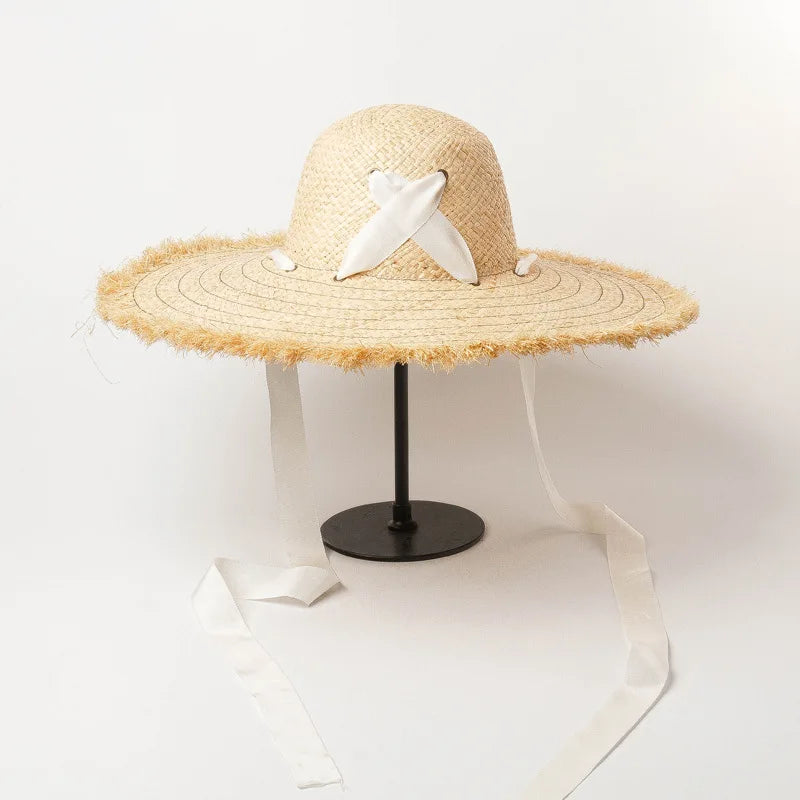 Naturlige Raffia Women Wide Brim Straw Hats Solshade Høy kvalitet Fedora Straw Hats Outdoor Travel Sand Bowknot Straw Hats