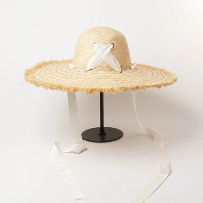 Naturlige Raffia Women Wide Brim Straw Hats Solshade Høy kvalitet Fedora Straw Hats Outdoor Travel Sand Bowknot Straw Hats