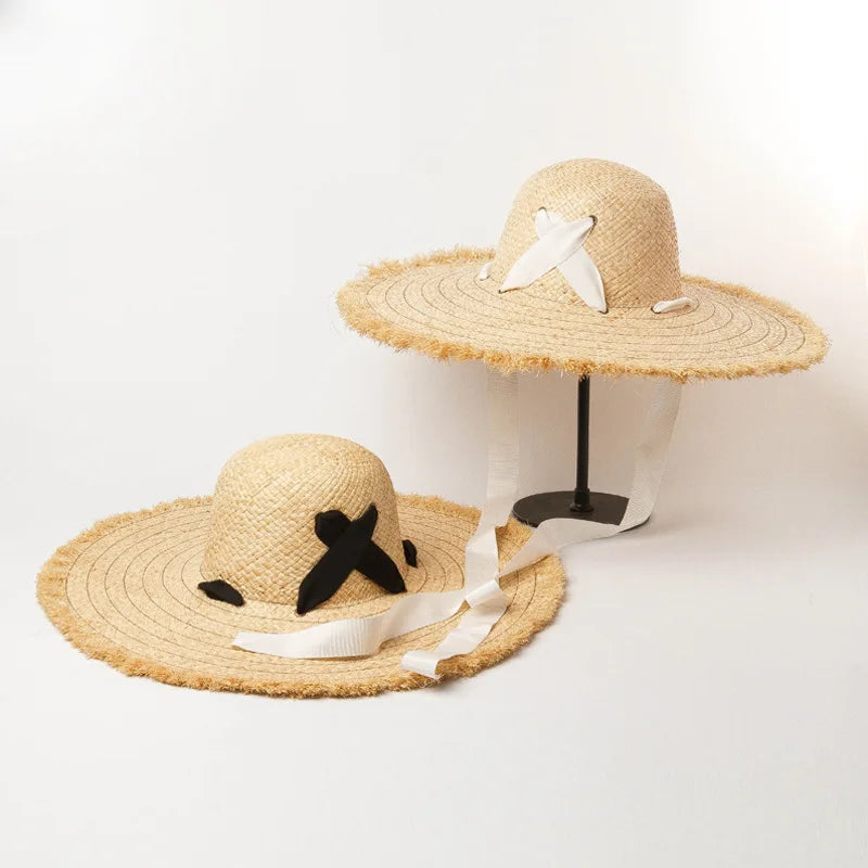 Naturlige Raffia Women Wide Brim Straw Hats Solshade Høy kvalitet Fedora Straw Hats Outdoor Travel Sand Bowknot Straw Hats